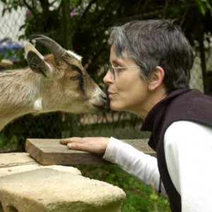 Sally kissing a goat
